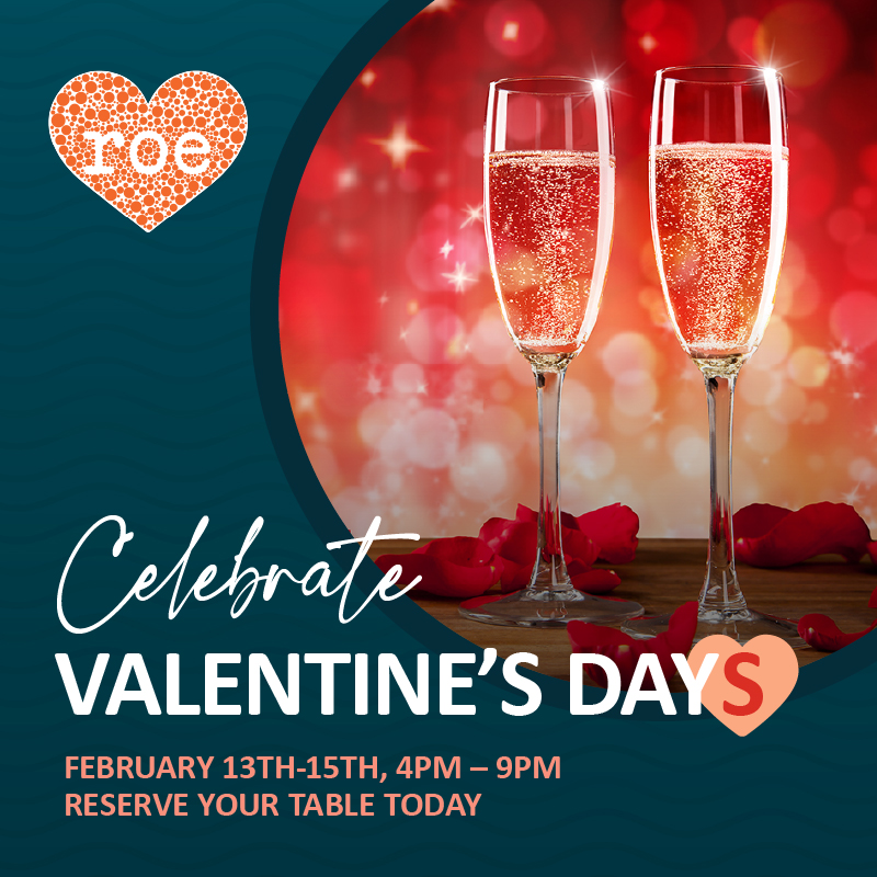 Two glasses of sparkling wine with rose petals, promoting Valentines Day celebration at a restaurant.